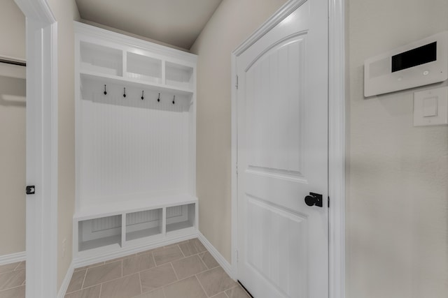 mudroom with light tile patterned floors