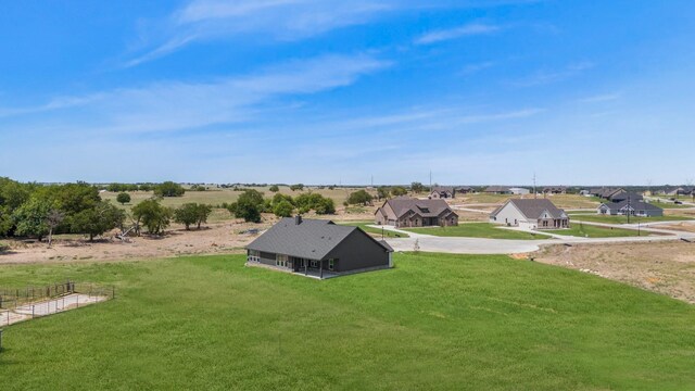 birds eye view of property with a rural view