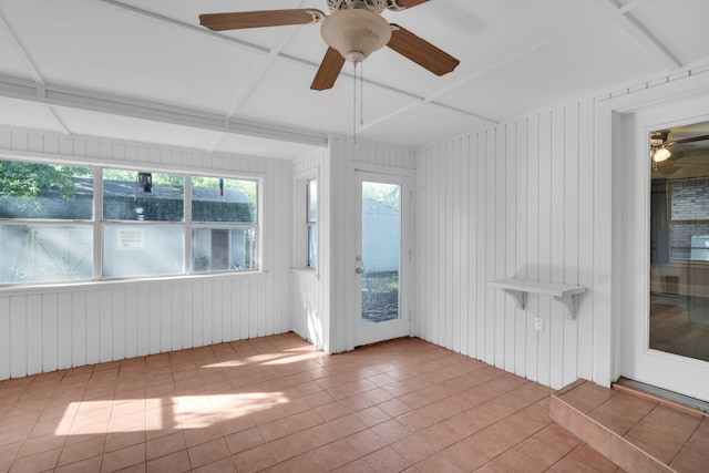 unfurnished sunroom featuring coffered ceiling and ceiling fan