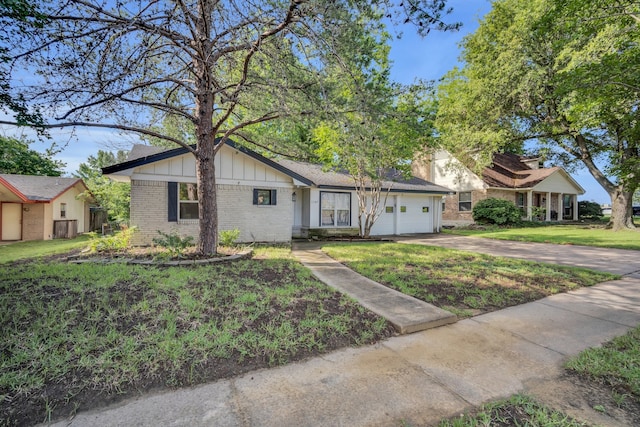 view of front of home with a garage and a front yard