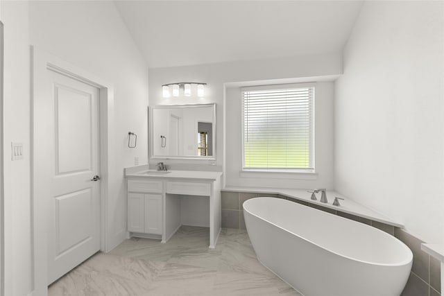 bathroom featuring vanity, tile patterned floors, tile walls, vaulted ceiling, and a bathing tub