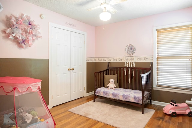 bedroom with dark wood-type flooring and ceiling fan