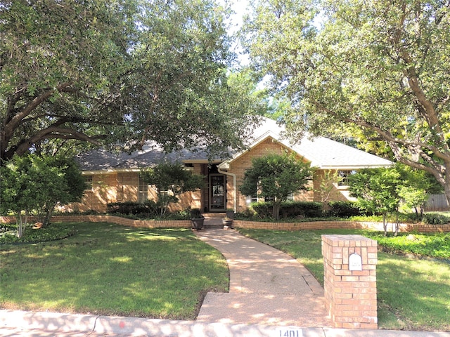 view of front of home with a front yard