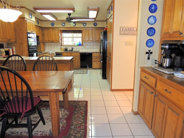 kitchen featuring black appliances, backsplash, sink, ceiling fan, and light tile floors