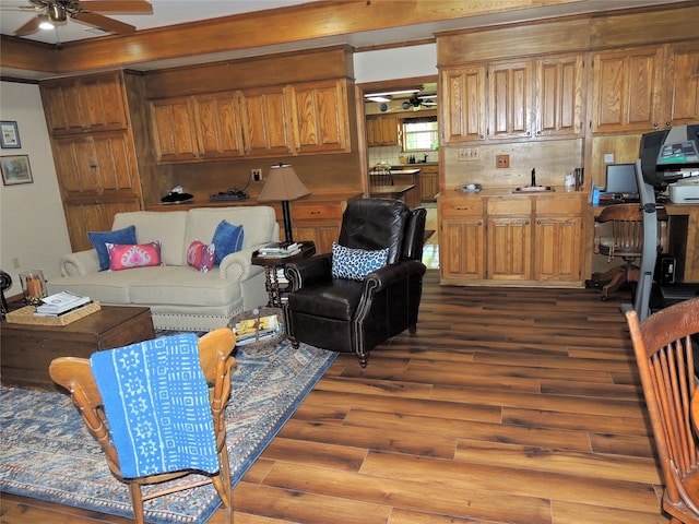 living room with ceiling fan and hardwood / wood-style floors