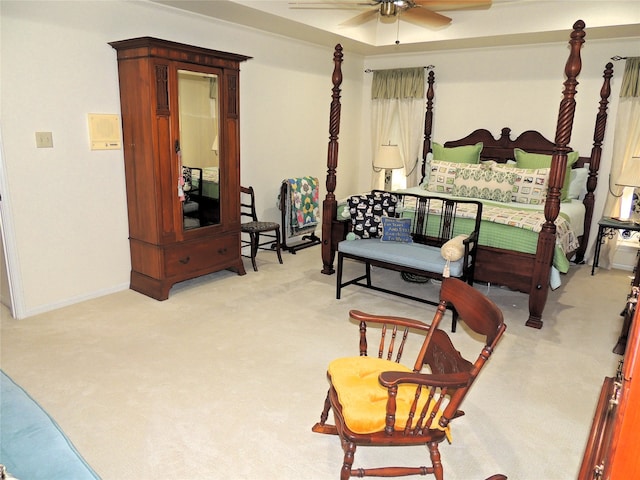 bedroom featuring ceiling fan and light colored carpet