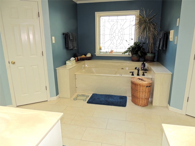 bathroom featuring a tub, tile floors, and vanity