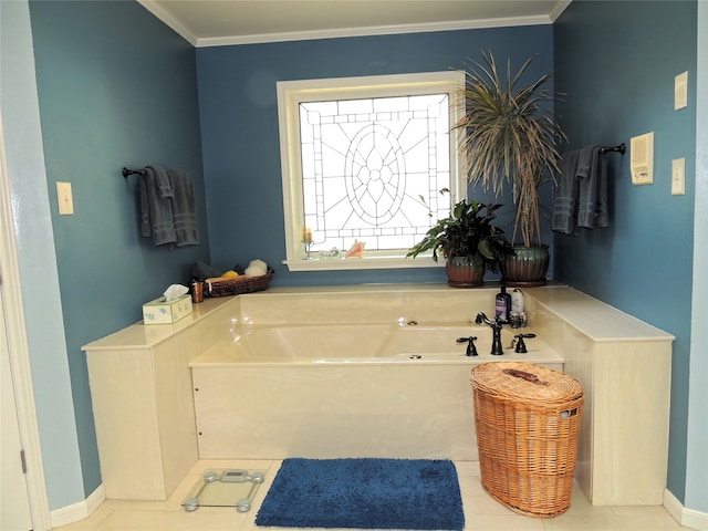 bathroom with tile floors, ornamental molding, and a bathing tub