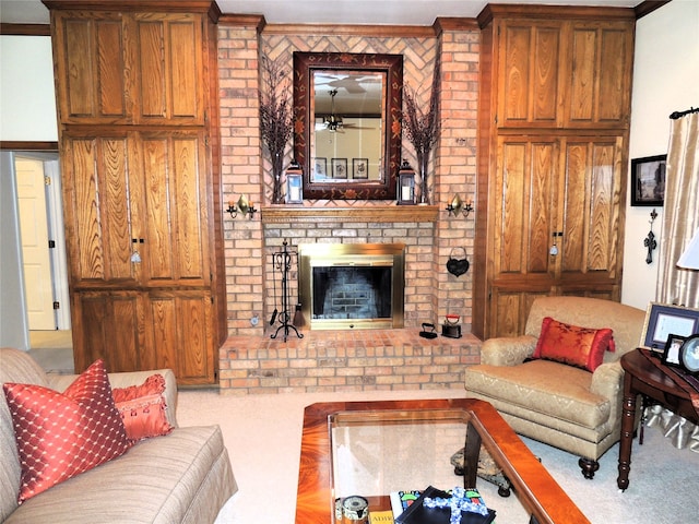 living room featuring ornamental molding, a fireplace, and carpet flooring