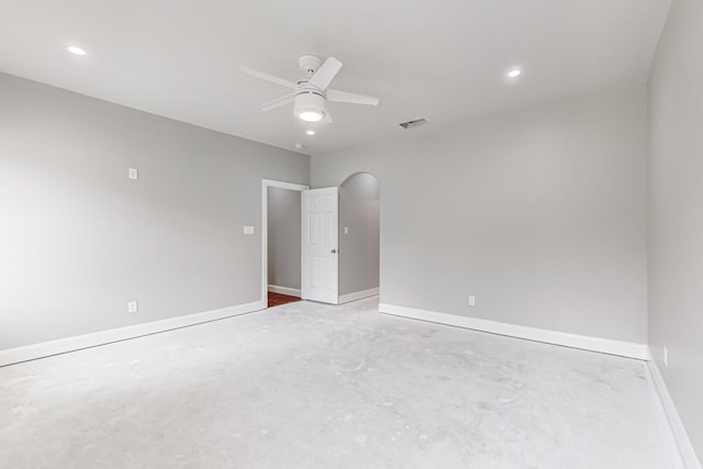 empty room with concrete flooring and ceiling fan