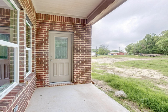 entrance to property with a patio area