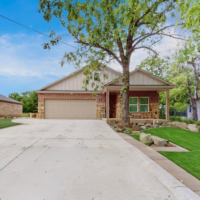 view of front of home with a front lawn and a garage