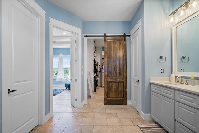 bathroom with oversized vanity and tile floors