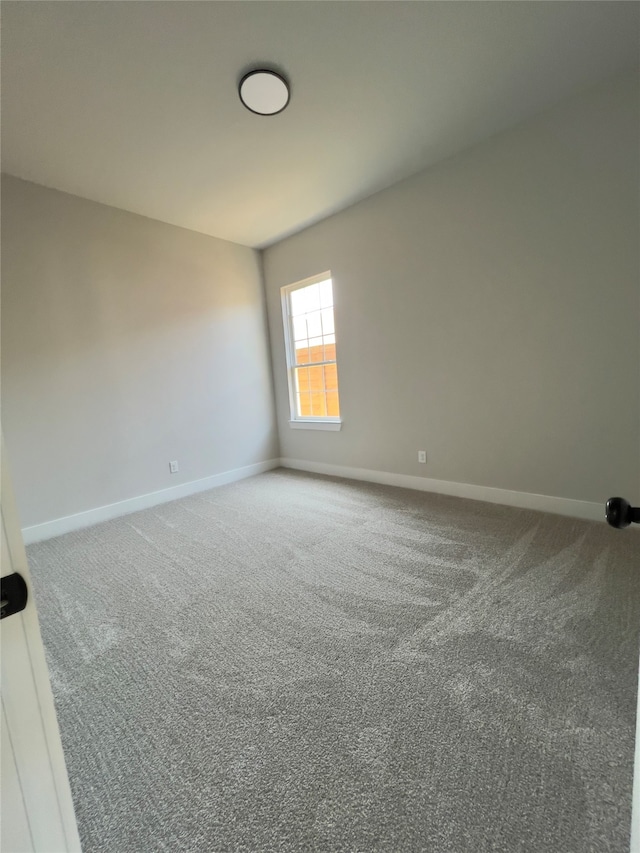 spare room featuring carpet