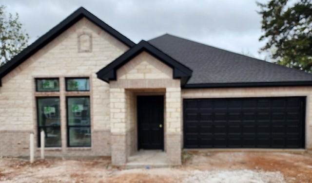 view of front of property with a garage