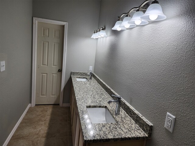 bathroom with tile patterned flooring and vanity