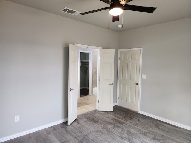 spare room featuring hardwood / wood-style flooring and ceiling fan