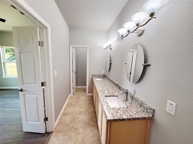 1507 Langston St, Fort Worth, TX 76105 - bathroom with double vanity and baseboards