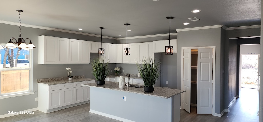 kitchen featuring white cabinetry and plenty of natural light