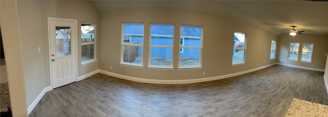 empty room featuring dark wood-type flooring and ceiling fan