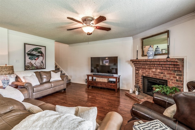 living area with dark wood-style floors, a brick fireplace, crown molding, and a textured ceiling