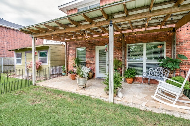 view of patio / terrace featuring fence