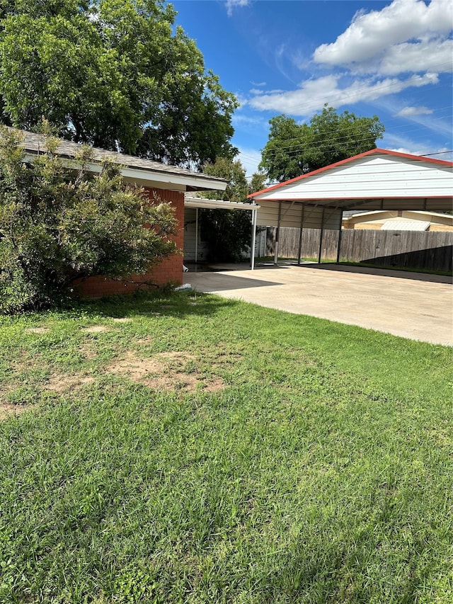 view of yard featuring a carport