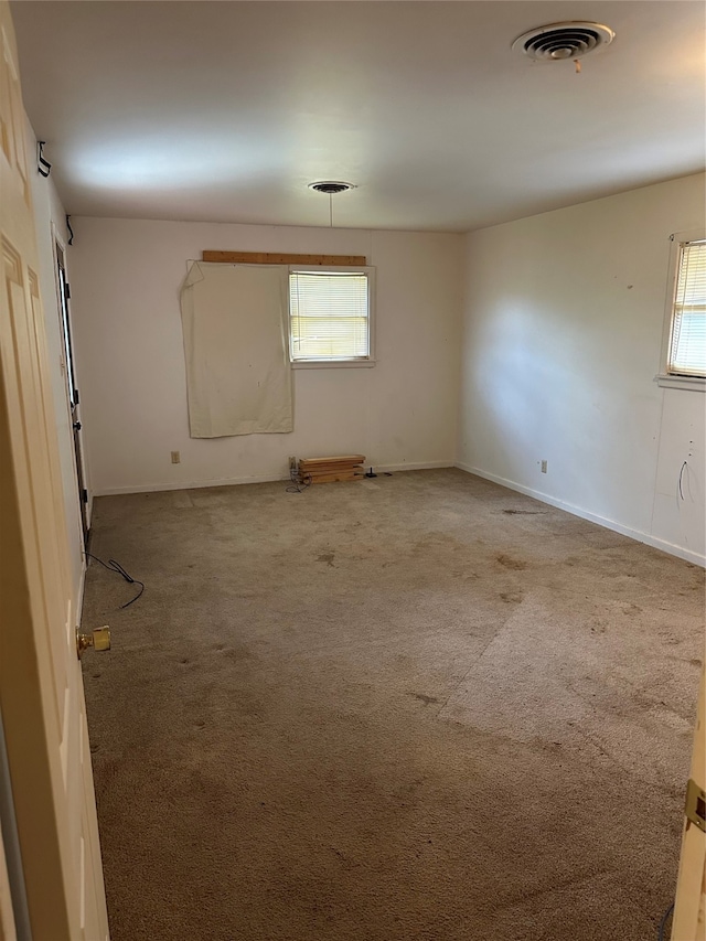 empty room with carpet flooring