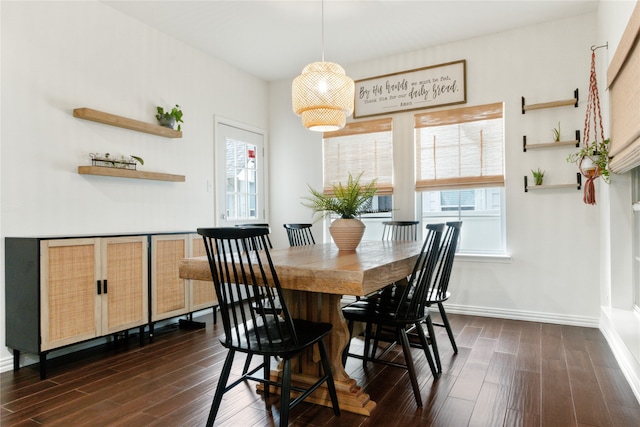 dining area featuring dark hardwood / wood-style flooring