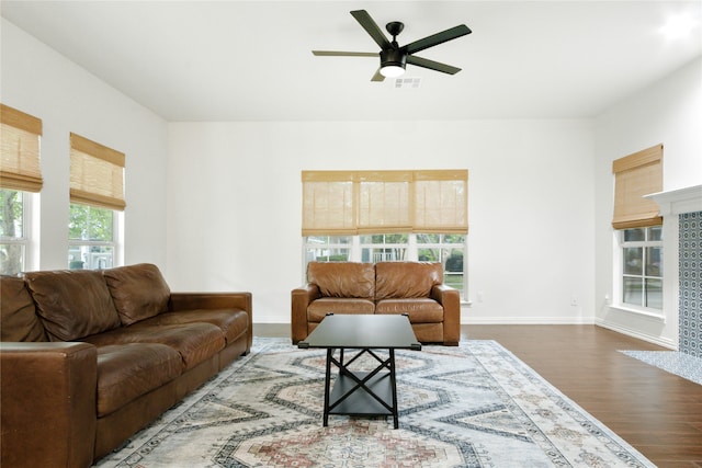 living room featuring hardwood / wood-style flooring and ceiling fan