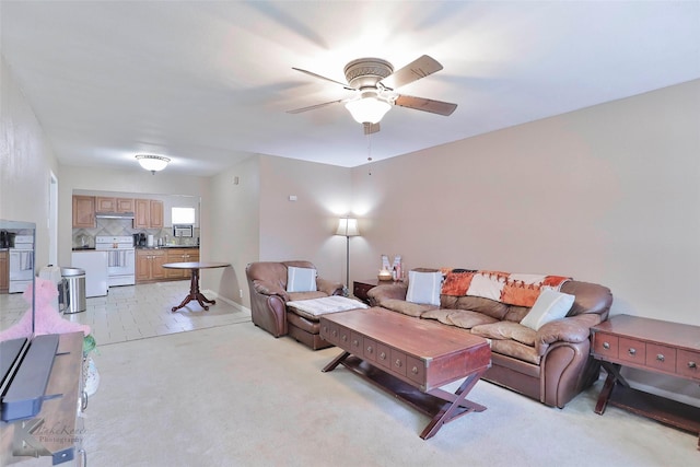 living room featuring ceiling fan and light colored carpet