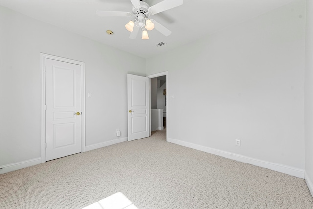 interior space with ceiling fan and carpet flooring