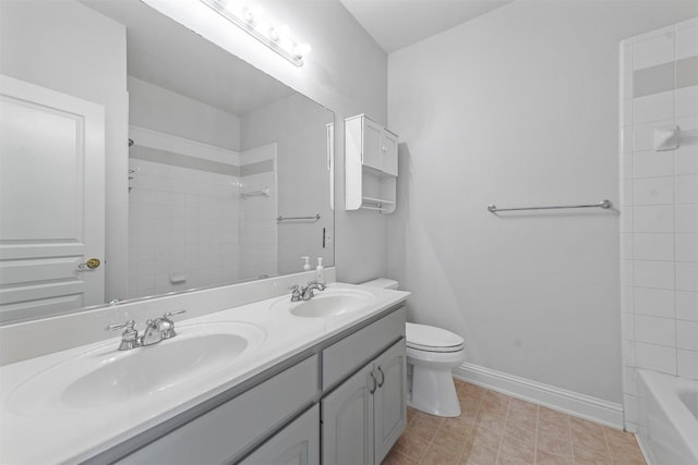 full bathroom featuring double sink, tile floors, vanity with extensive cabinet space, tiled shower / bath combo, and toilet