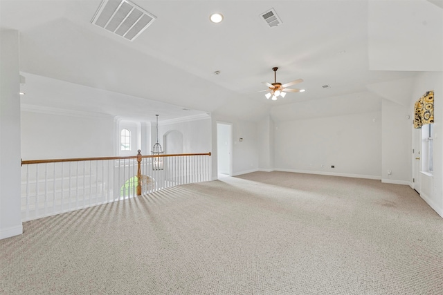 empty room featuring carpet, ceiling fan, and lofted ceiling