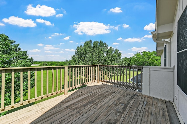 wooden terrace with a lawn