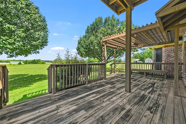 deck with a yard and a pergola