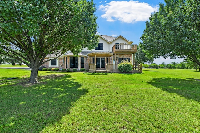 back of house with a yard