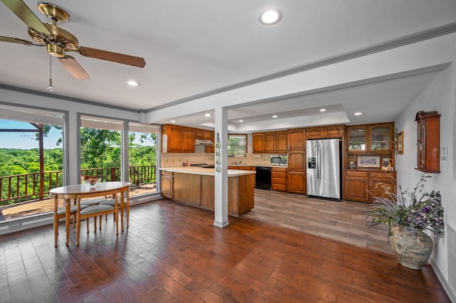 bedroom with dark wood-type flooring, ceiling fan, connected bathroom, and ornamental molding