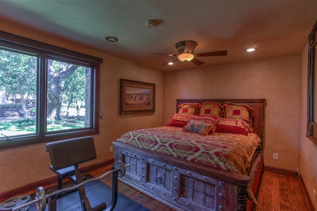 bedroom featuring ceiling fan and hardwood / wood-style floors