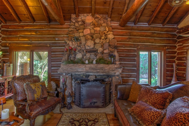 living room with a stone fireplace, vaulted ceiling with beams, wood-type flooring, log walls, and wooden ceiling