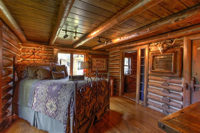 bedroom featuring hardwood / wood-style floors, rustic walls, and wood ceiling