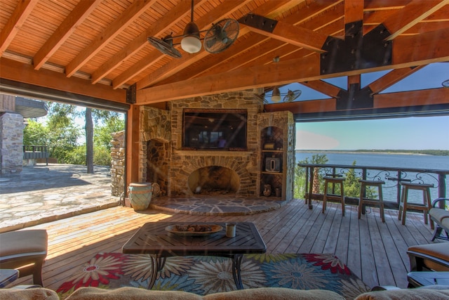 interior space featuring a water view, ceiling fan, wooden ceiling, hardwood / wood-style floors, and beam ceiling