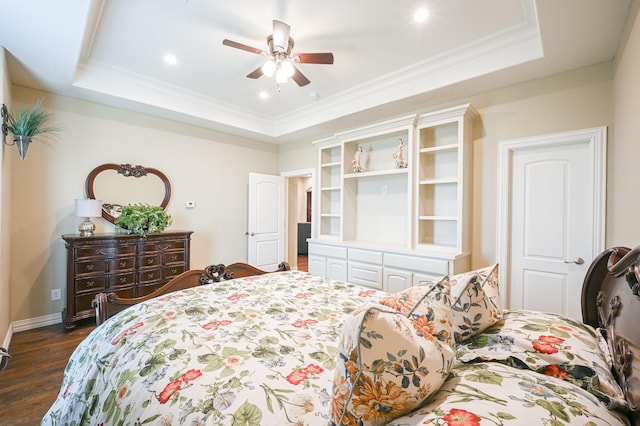 bedroom with dark hardwood / wood-style floors, a raised ceiling, ceiling fan, and crown molding