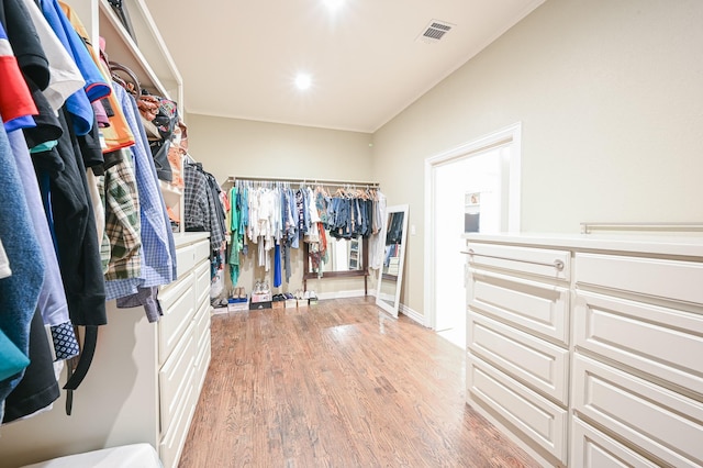 spacious closet featuring light hardwood / wood-style flooring