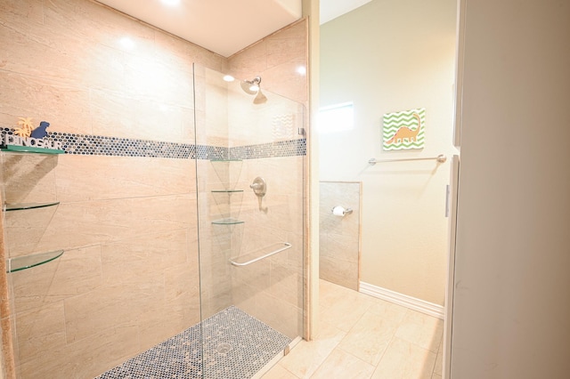 bathroom with a shower with shower door