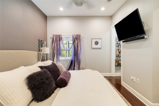 bedroom featuring dark hardwood / wood-style flooring