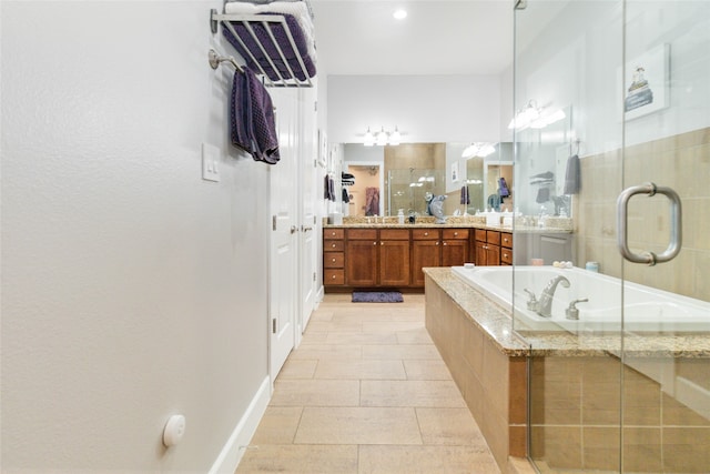 bathroom featuring vanity, tile patterned floors, and separate shower and tub