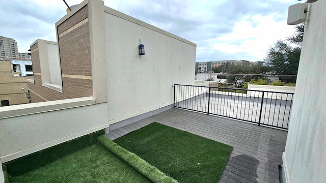 view of side of property with a balcony