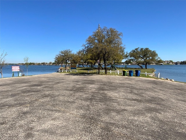 surrounding community with a water view