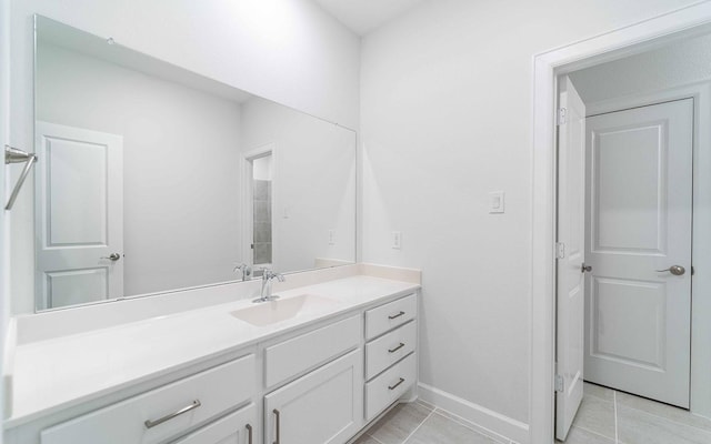 bathroom featuring tile patterned flooring and vanity